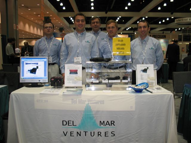 Del Mar Ventures table top booth at OFC 2004 show in Los Angeles 24-26 February 2004